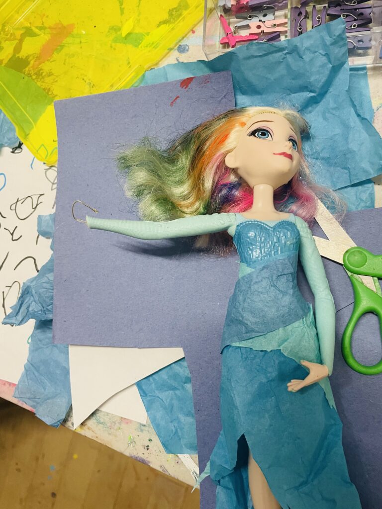 An Elsa doll with a hook in her arm and dyed hair is the product of a Durham art camp experience